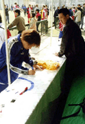 an olympic flag is signed by a laowai 